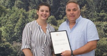 Farm Resilience Award won by pig producer Ellie Jesson, from the Prince’s Countryside Fund, presented the award to Packing-ton Pork's pig production director, John Clappison