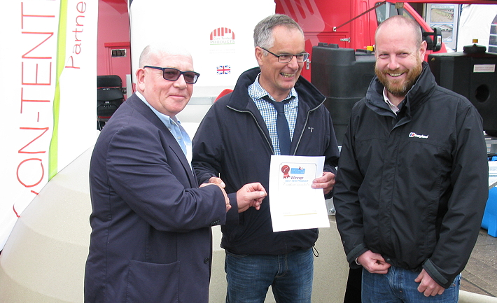 The managing director of Pig World's publisher, Lewis Business Media, John Lewis, presents the winner's certificate to Adrian Lawson of Rattlerow Farms, as Jamie Macdonald of Contented products looks on.