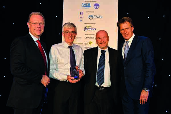 Grant Morrow and Andrew Feemantle received the Indoor Producer award from Jonathan Farnhill, ForFarmers business unit director, with host Andrew Castle, right