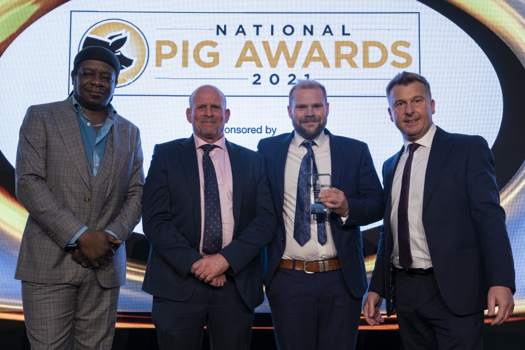 Tim and Tom Bradshaw received their awards from ForFarmers' Craig Saunders (rightt), with host Stephen K Amos (left)